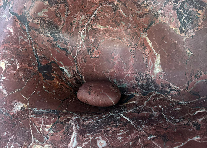 A sculpted Pilbara red stone sculpture